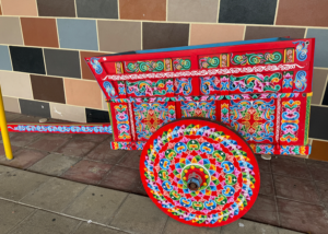 a colorful painted oxcart 